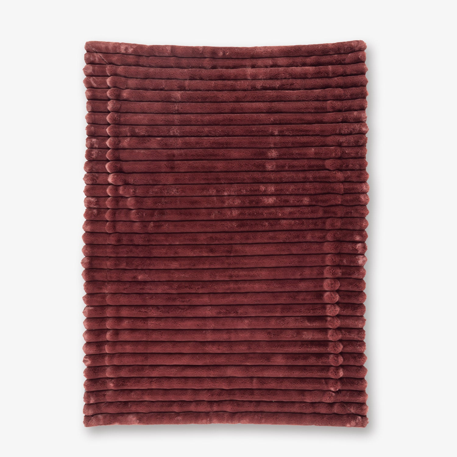 Burgundy textured blanket on a white background