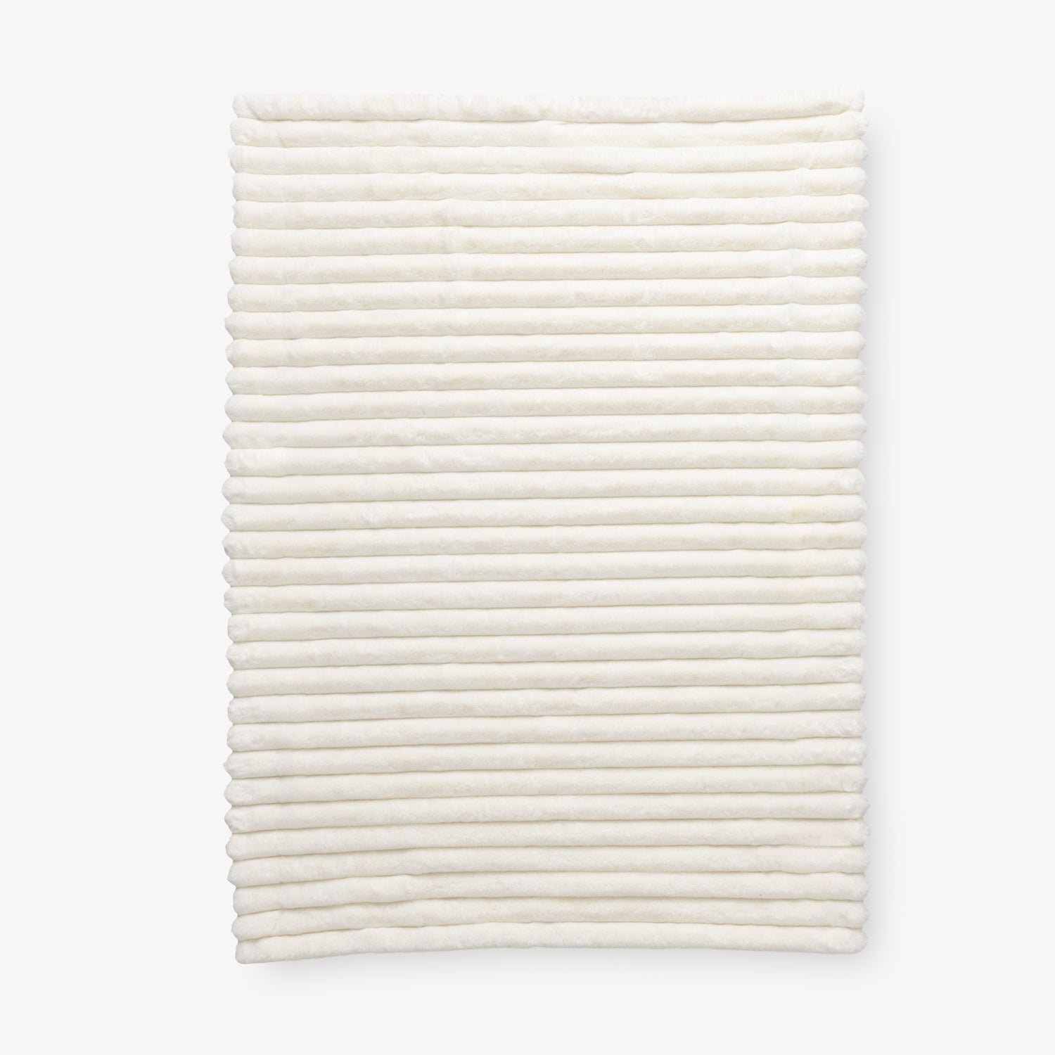White textured throw laid flat on a white background