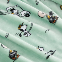 Fabric with cartoon character pattern on a light green background