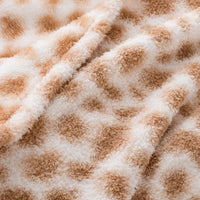 Close-up of a safari-patterned surface with brown and white colors.