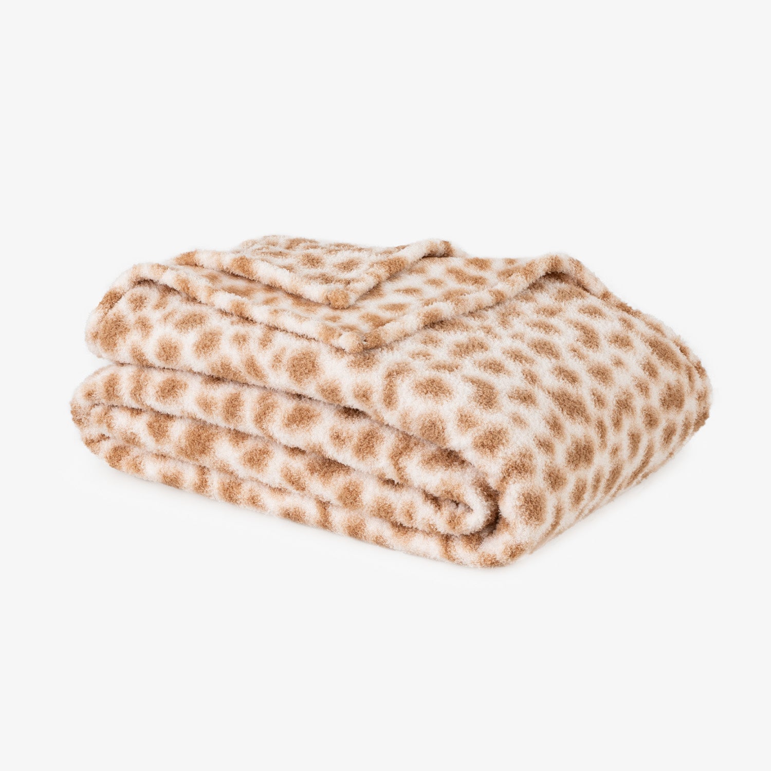 Folded blanket with brown and white pattern on a white background
