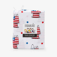 Peanuts themed sheet set packaging with Snoopy and Woodstock on a white background