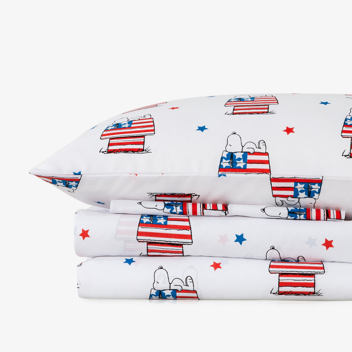 Pillowcases and bed sheets with dog and flag pattern on a white background