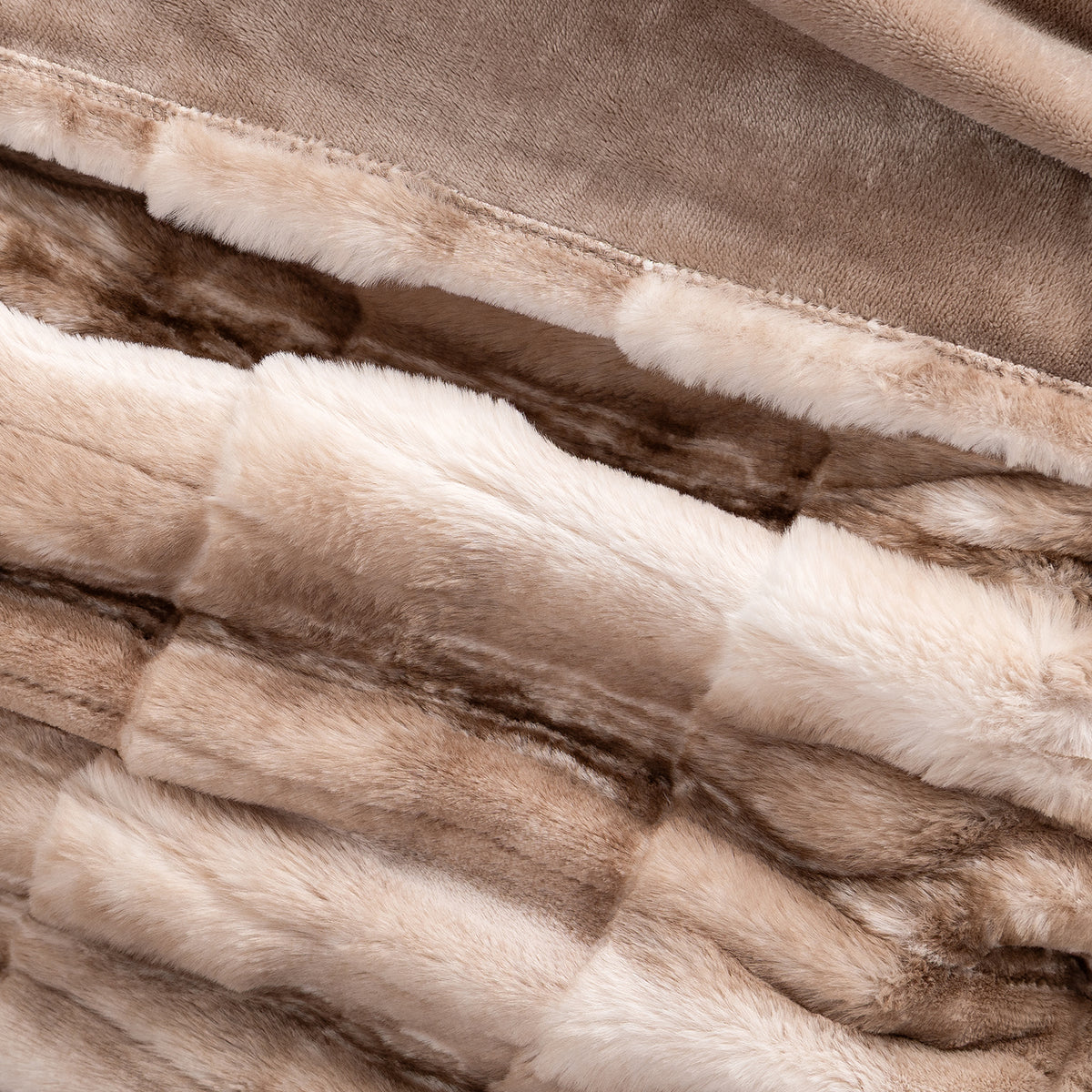 Close up of a plush textured faux fur heated throw.