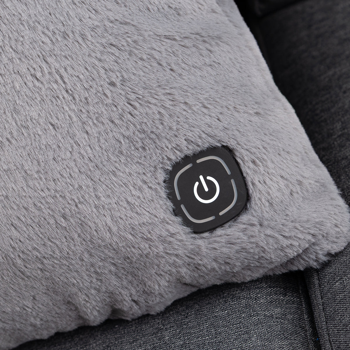 Close up of a grey heated lumbar pillow.