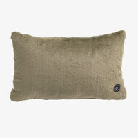 A rectangular plush lumbar pillow in a muted taupe-gray color, featuring a small black circular control button on the lower right corner, set against a plain white background.