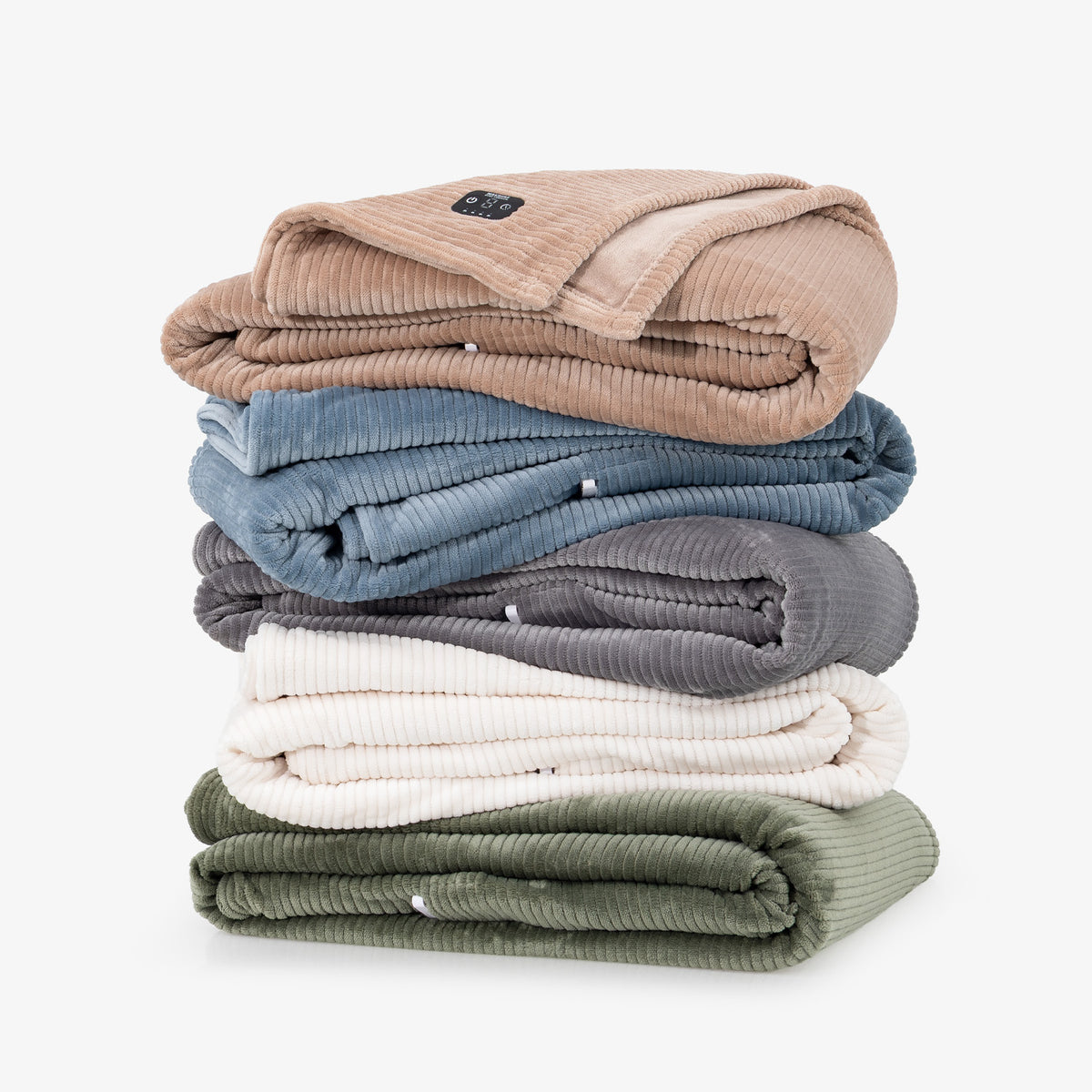 A stack of five folded corduroy blankets in beige, dusty blue, charcoal gray, cream, and sage green, arranged neatly on a light gray background.