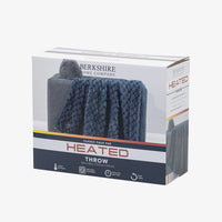 Berkshire Home Company Classic Faux Fur Heated Throw blanket in a dark blue-gray color, shown inside its retail packaging box against a light gray background.