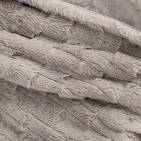 Close up of a taupe plush faux fur texted heated throw.