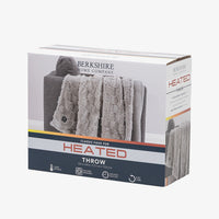 Packaging of a classic faux fur heated throw blanket featuring 4 heat settings, machine washability, 4 hour auto shut off, and an 8.3ft long cord.