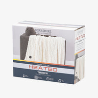 Packaging of a classic faux fur heated throw blanket featuring 4 heat settings, machine washability, 4 hour auto shut off, and an 8.3ft long cord.