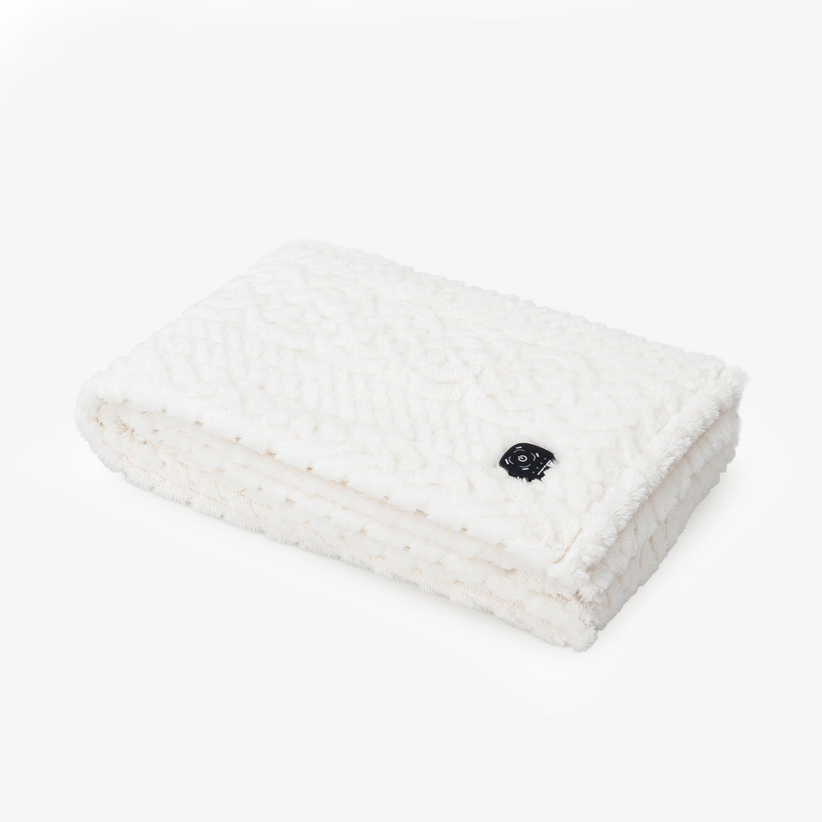 Cream colored faux fur heated throw folded neatly on a white surface.