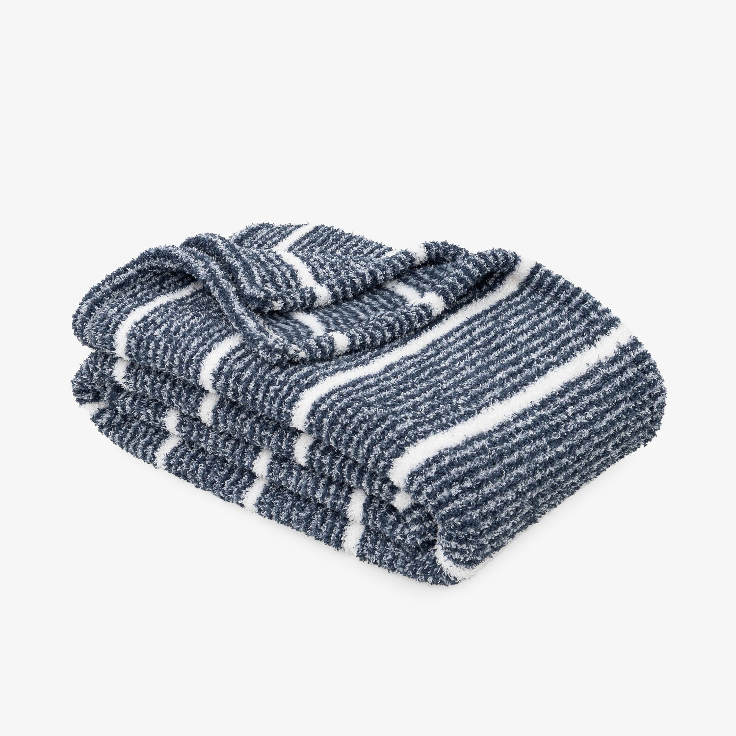A folded striped knit blanket in navy blue and white, shown on a clean light gray background.
