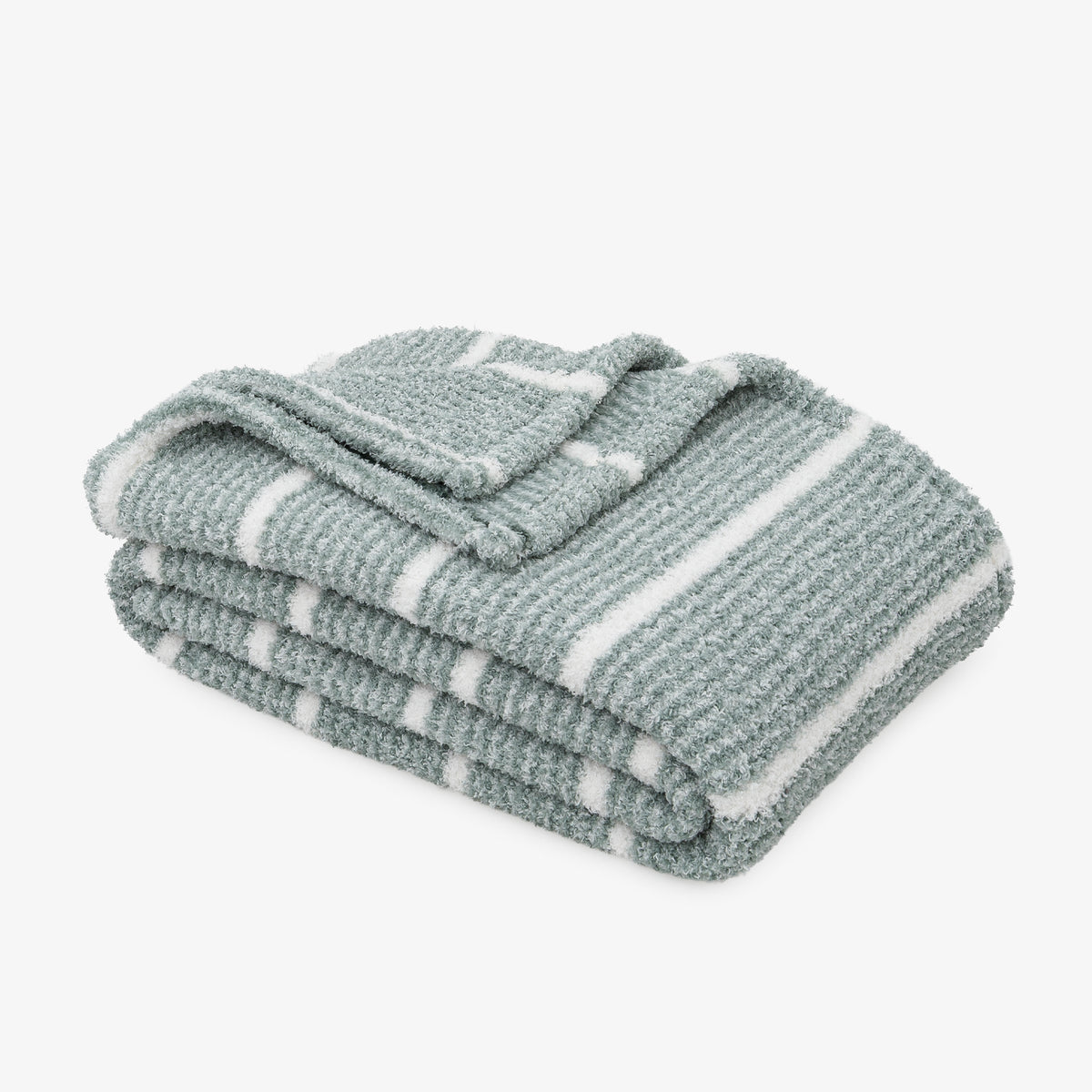 A folded textured throw blanket with white stripes on a light gray background.