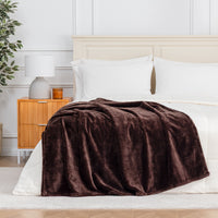 Premium VelvetLoft® Throw in Colt, draped across the foot of a bed