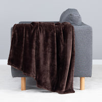 Premium VelvetLoft® Throw in Colt, draped over the arm of a gray sofa, close view