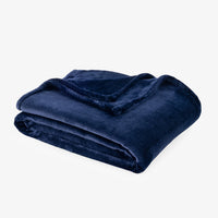 Premium VelvetLoft® Throw in Midnight Blue, folded on a white background