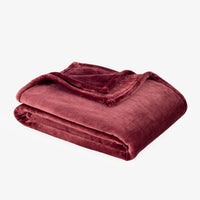 Premium VelvetLoft® Throw in Roanoke Red, folded on a white background