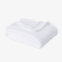 Premium VelvetLoft® Throw in True White, folded on a white background