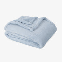 Premium Extra-Fluffy™ Throw in Arctic Blue, folded on a white background