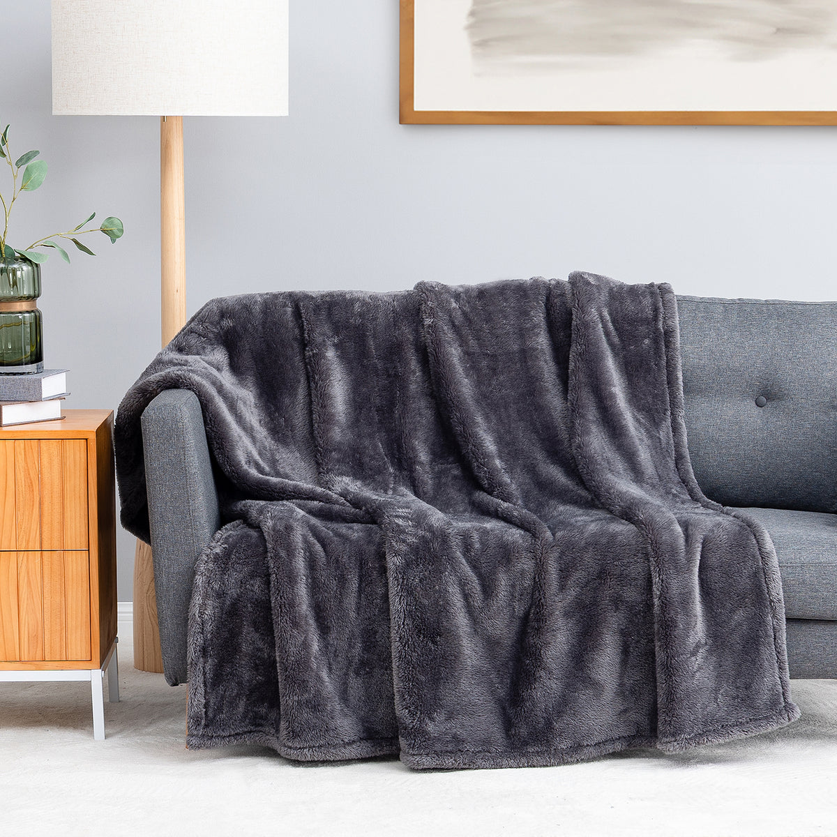 Premium Extra-Fluffy™ Throw in Castle Rock draped over a gray sofa in a living room