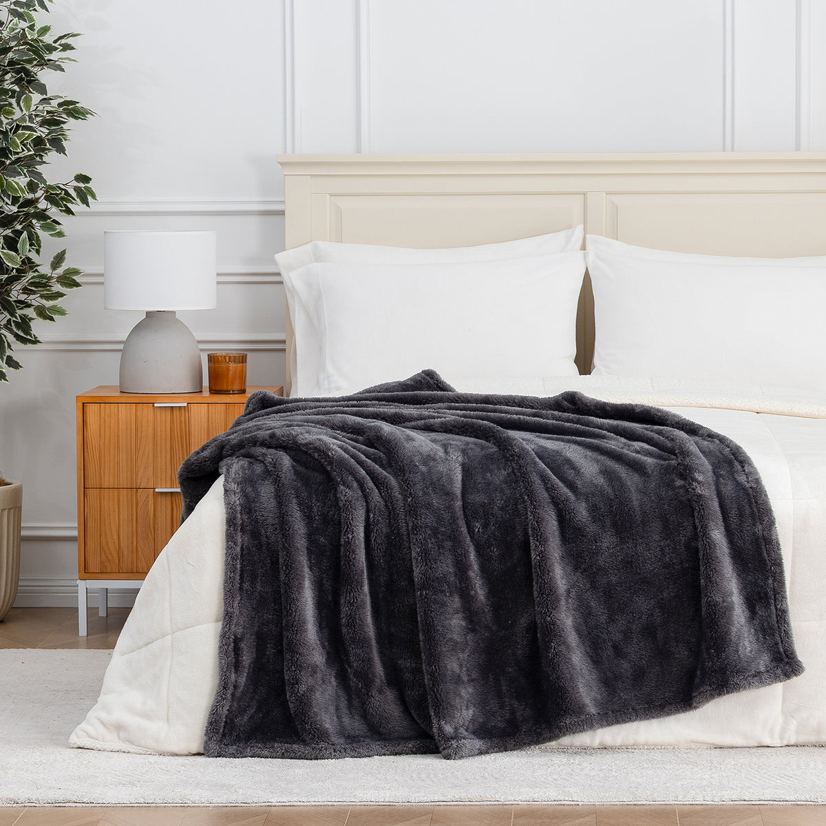 Premium Extra-Fluffy™ Throw in Castle Rock draped across the foot of a bed