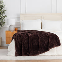 Premium Extra-Fluffy™ Throw in Coffee Brown draped across the foot of a bed