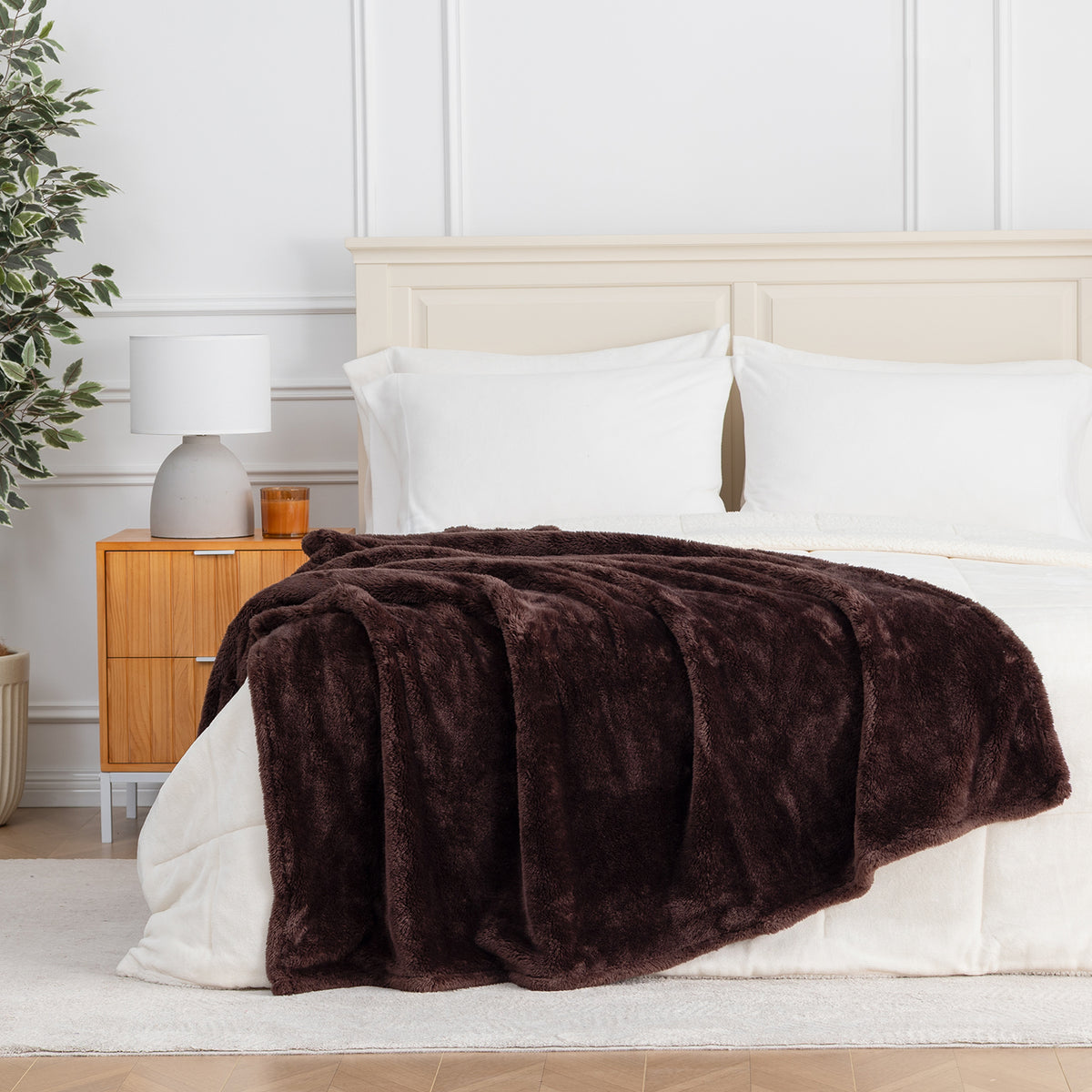Premium Extra-Fluffy™ Throw in Coffee Brown draped across the foot of a bed