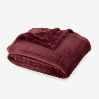 Premium Extra-Fluffy™ Throw in Deep Fig, folded on a white background