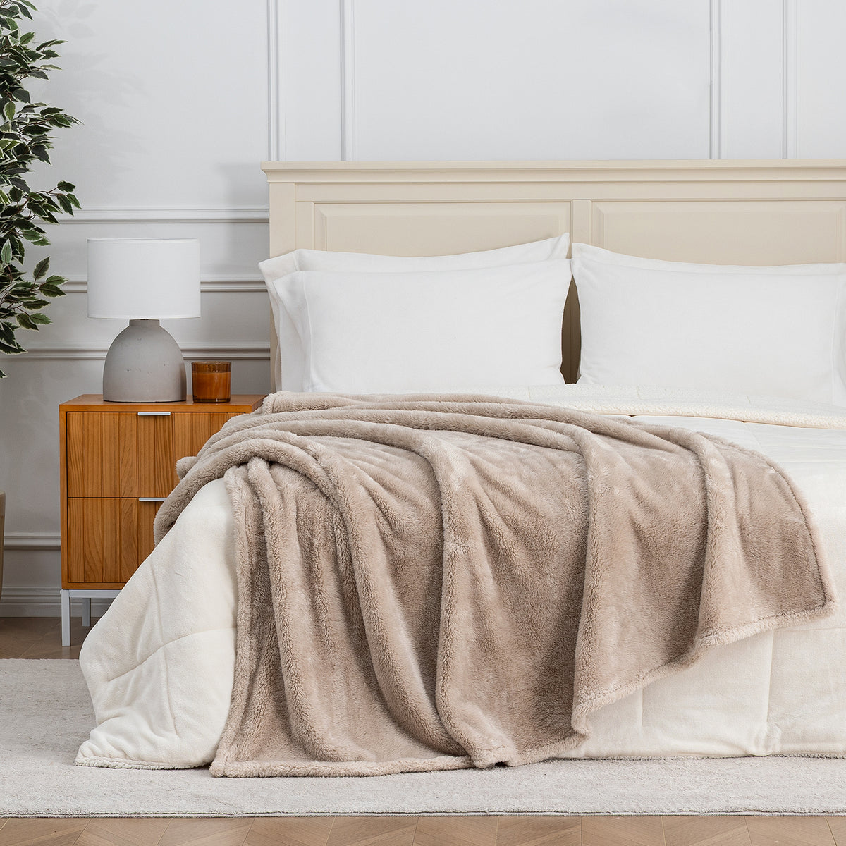 Premium Extra-Fluffy™ Throw in Grain draped across the foot of a bed