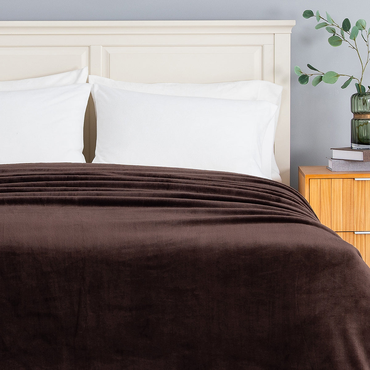 Premium VelvetLoft® Blanket in Colt across the foot of a made bed with white pillows, close view
