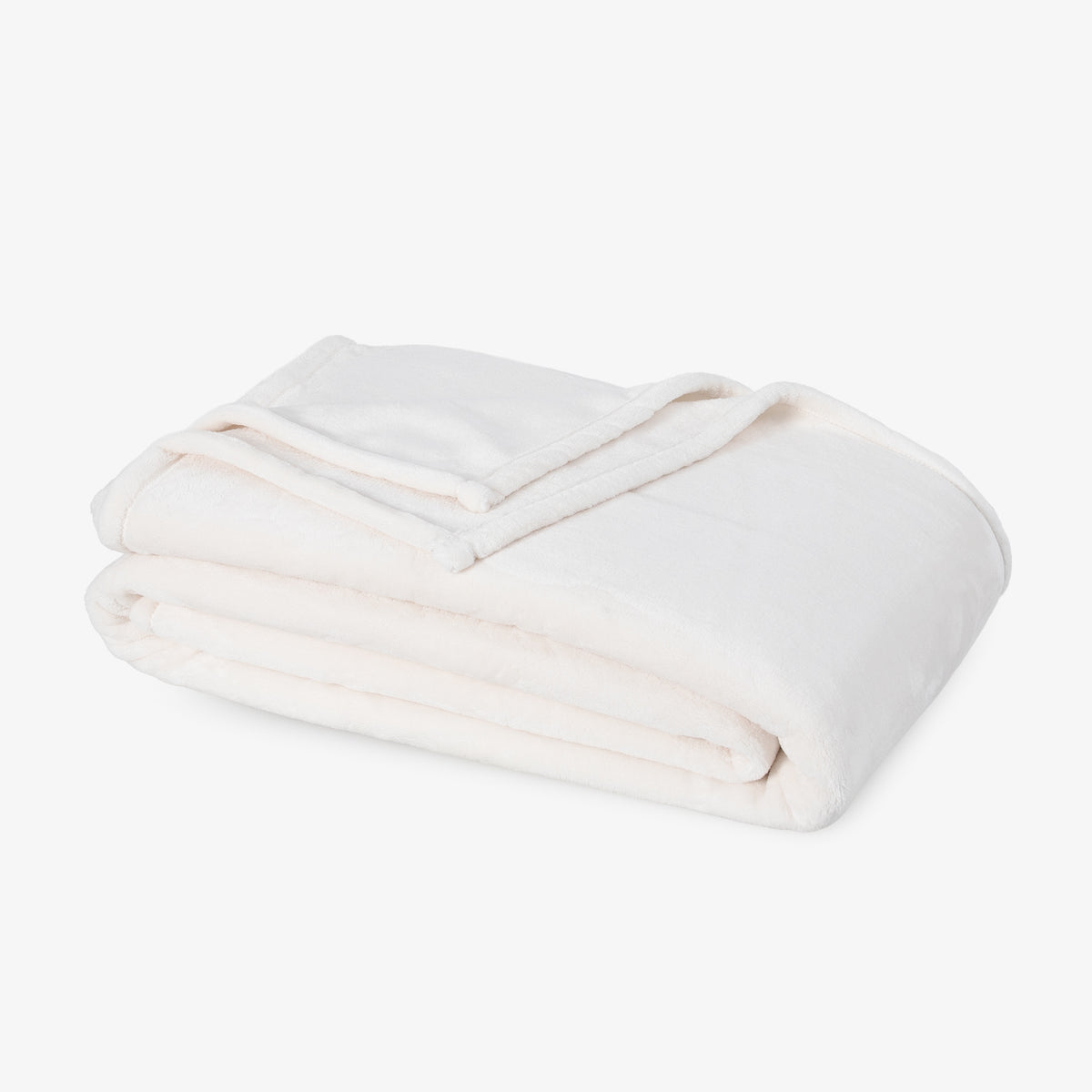 Premium VelvetLoft® Blanket in Cream, folded on a white background