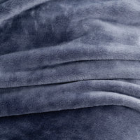 A close-up of plush, soft fabric in a muted slate blue-gray color, showing the texture and folds of the material.