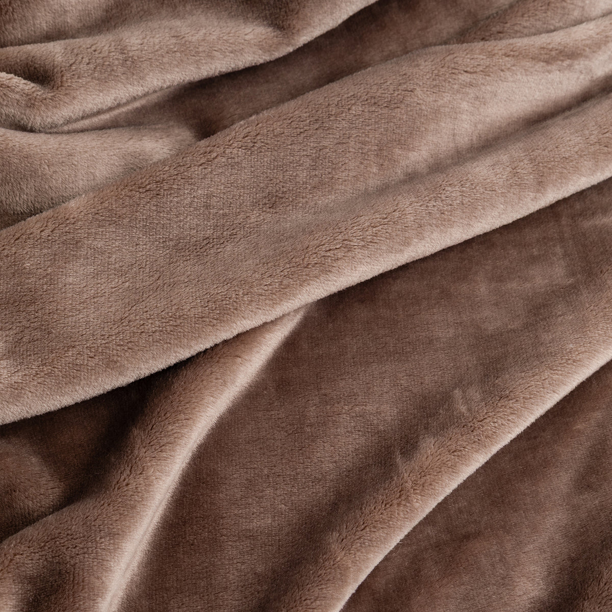 A close-up of draped plush fabric in a warm taupe-brown color, showing the soft texture and folds of the material.