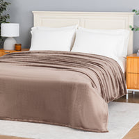 Premium VelvetLoft® Blanket in Porcini on a made bed, angled view