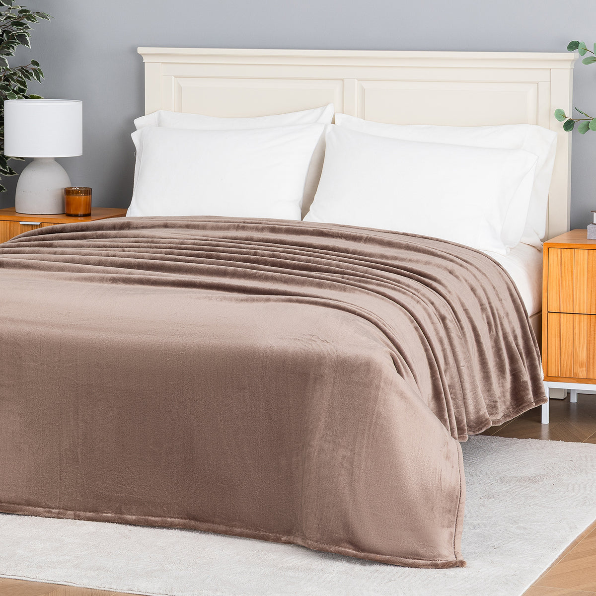 Premium VelvetLoft® Blanket in Porcini on a made bed, angled view