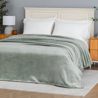 Premium VelvetLoft® Blanket in Rolling Hills on a made bed, angled view