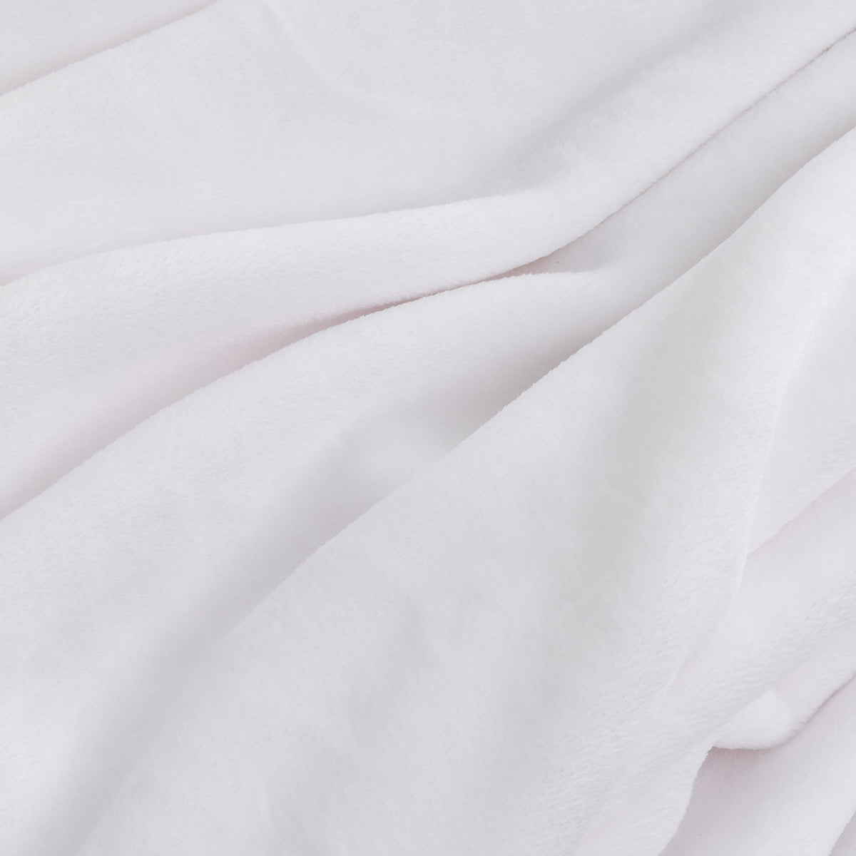 A close-up of soft white fabric with gentle folds and a smooth, slightly plush texture.