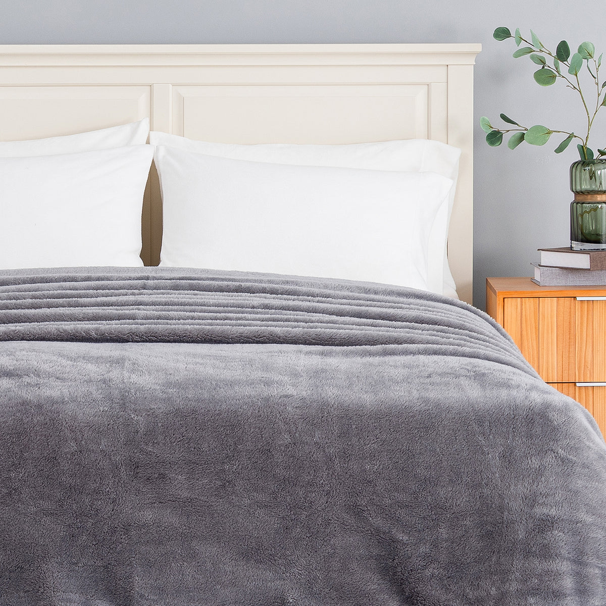 Premium Extra-Fluffy™ Blanket in Amherst Gray turned down at the head of a bed, close view