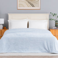 Premium Extra-Fluffy™ Blanket in Arctic Blue on a made bed, front view