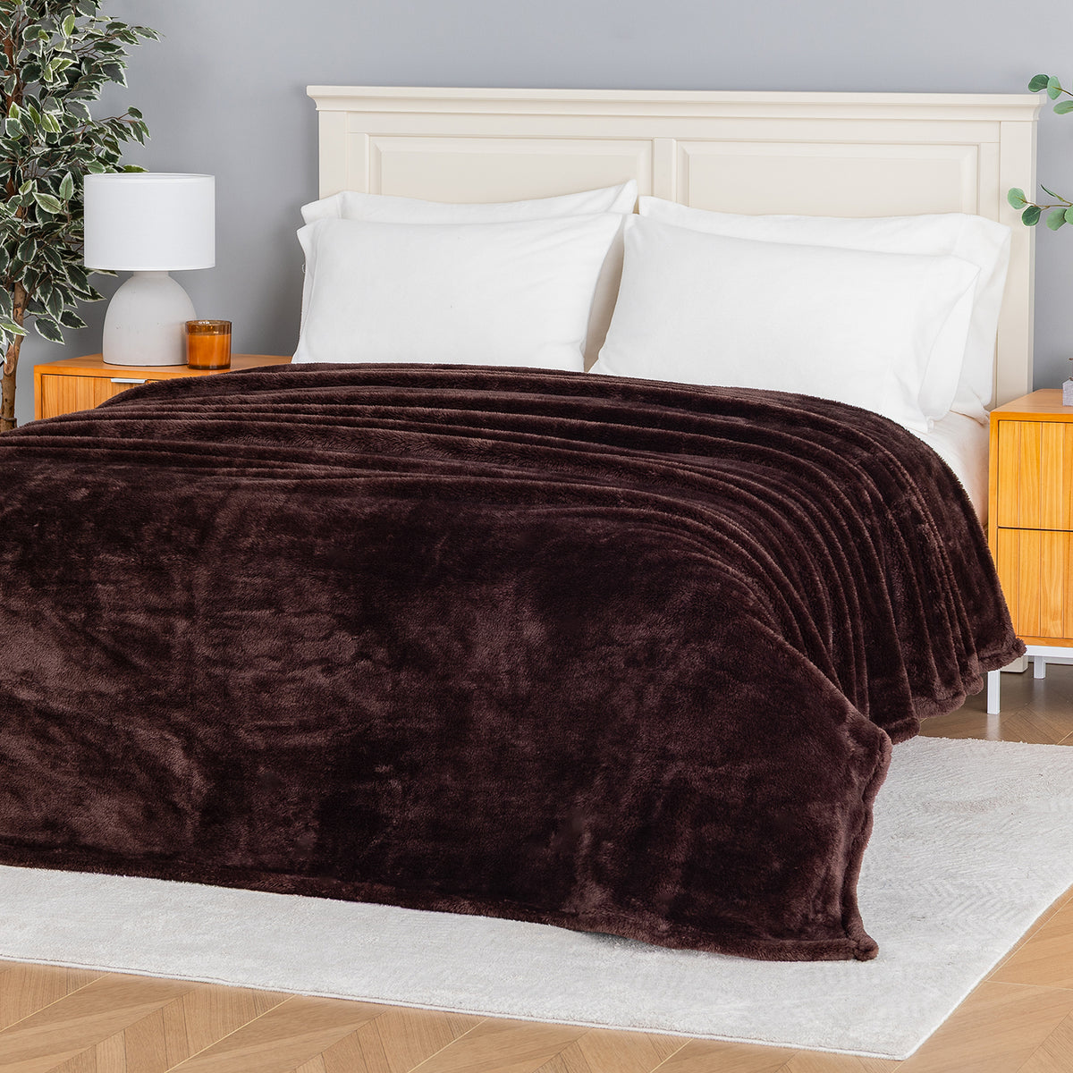 Premium Extra-Fluffy™ Blanket in Coffee Brown spread over a made bed, angled view