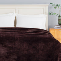 Premium Extra-Fluffy™ Blanket in Coffee Brown turned down at the head of a bed, close view