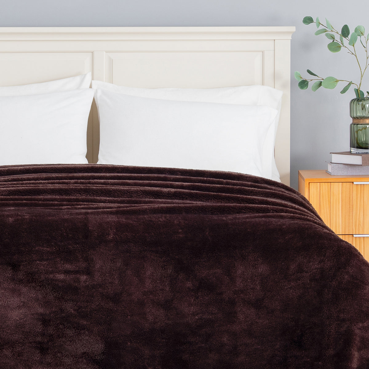 Premium Extra-Fluffy™ Blanket in Coffee Brown turned down at the head of a bed, close view