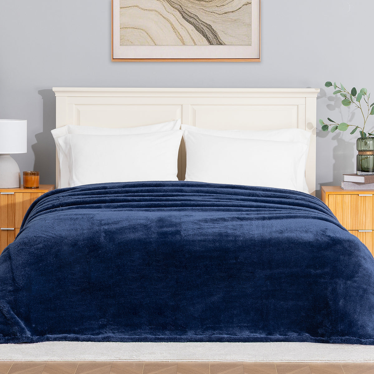 Premium Extra-Fluffy™ Blanket in Dress Blue on a made bed, front view