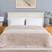 Premium Extra-Fluffy™ Blanket in Grain on a made bed, front view