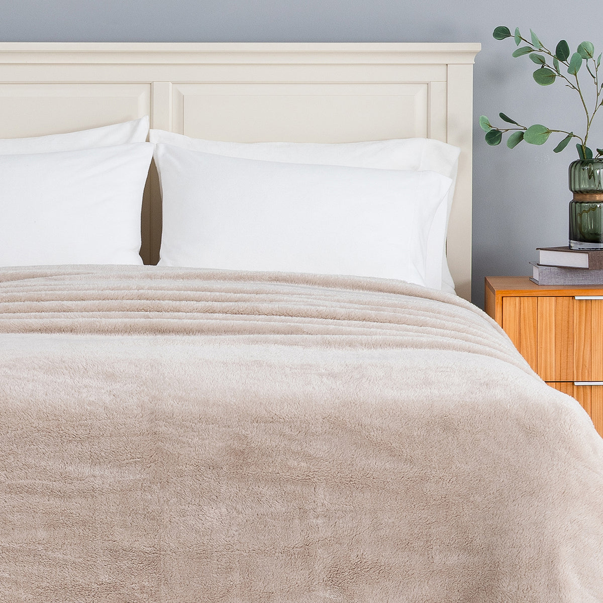 Premium Extra-Fluffy™ Blanket in Grain turned down at the head of a bed, close view