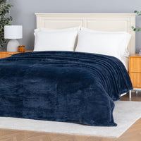 Premium Extra-Fluffy™ Blanket in Historical Blue spread over a made bed, angled view