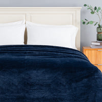 Premium Extra-Fluffy™ Blanket in Historical Blue turned down at the head of a bed, close view
