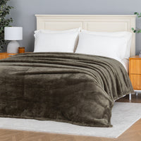 Premium Extra-Fluffy™ Blanket in Kalamata spread over a made bed, angled view