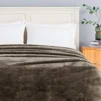 Premium Extra-Fluffy™ Blanket in Kalamata turned down at the head of a bed, close view
